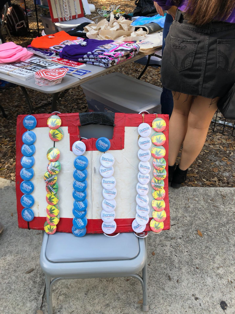 Figure 4. Image showing buttons for marijuana legislation and Bernie Sanders sold at Lake Eola Park on Jan. 19, 2019.