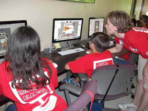 Girls work on their robot band pictures