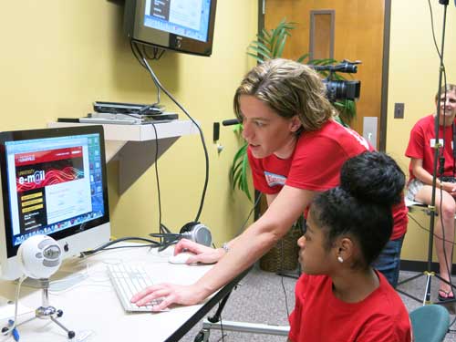 Rachel helps a camper in the greenscreen room