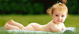 a girl toddler sunbathes