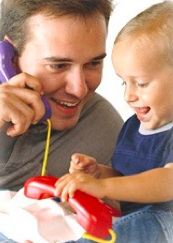 man teachinig and playing with toy phone