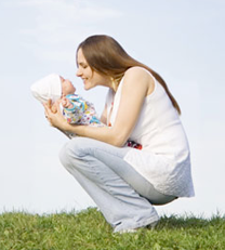 woman nuzzling child