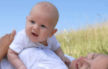 woman snuggling child